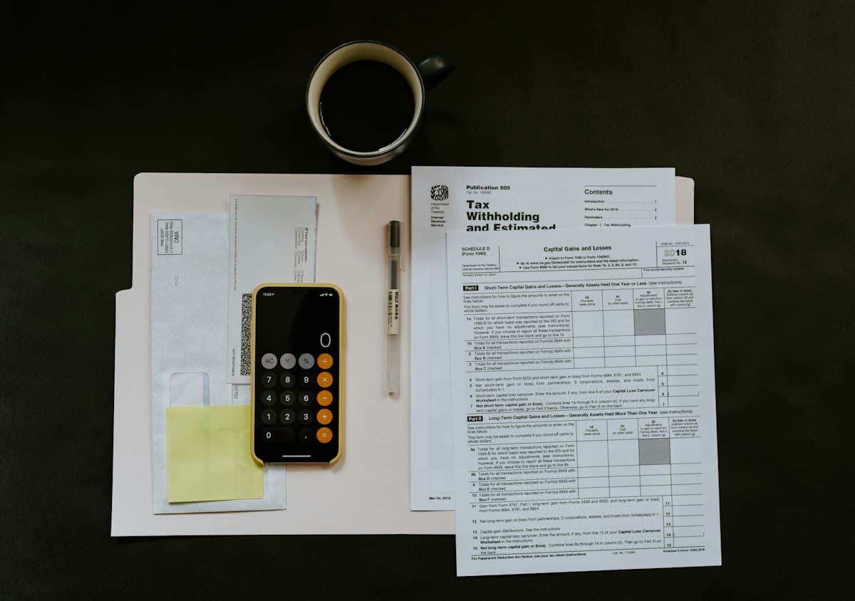 Restaurant bill check with credit card, payment receipt, and pen on wooden counter