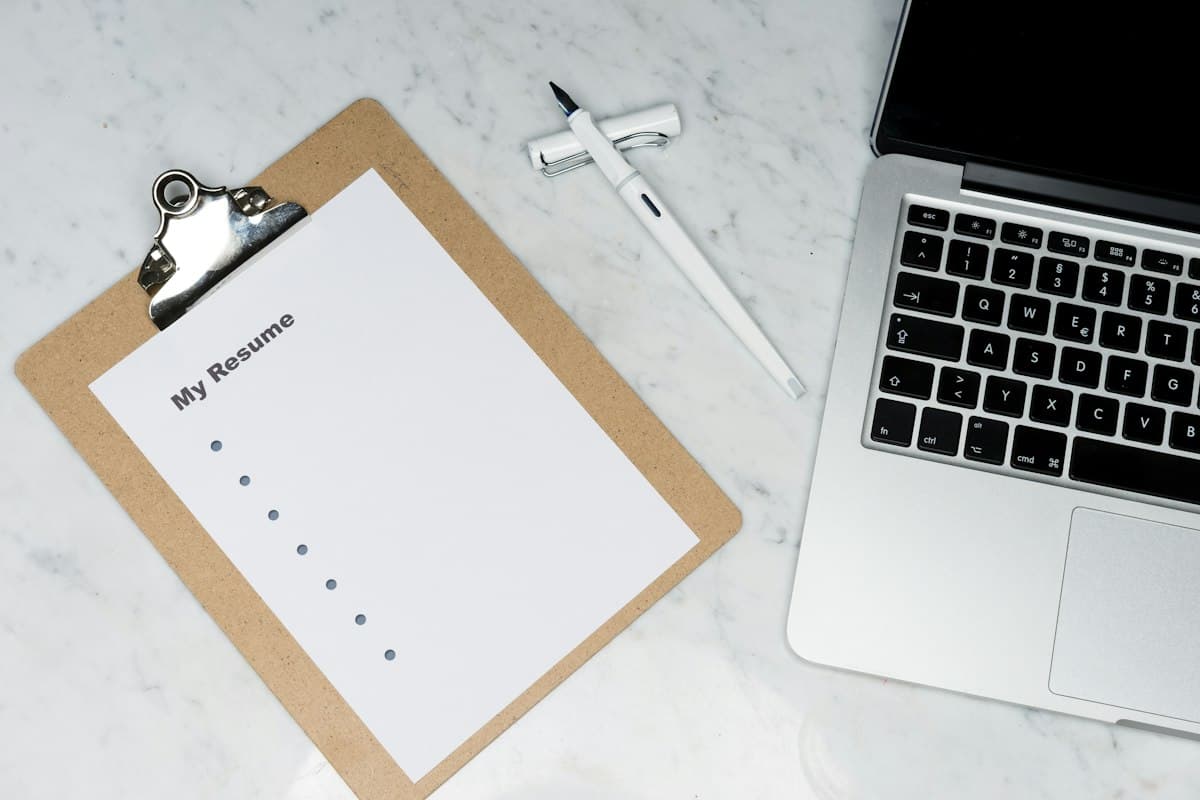 Professional candidate resume documents on a minimalist office desk
