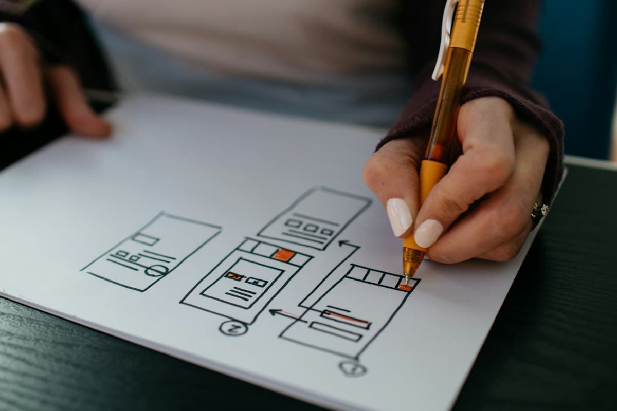 Product designer testing user interface contrast and typography on an external monitor