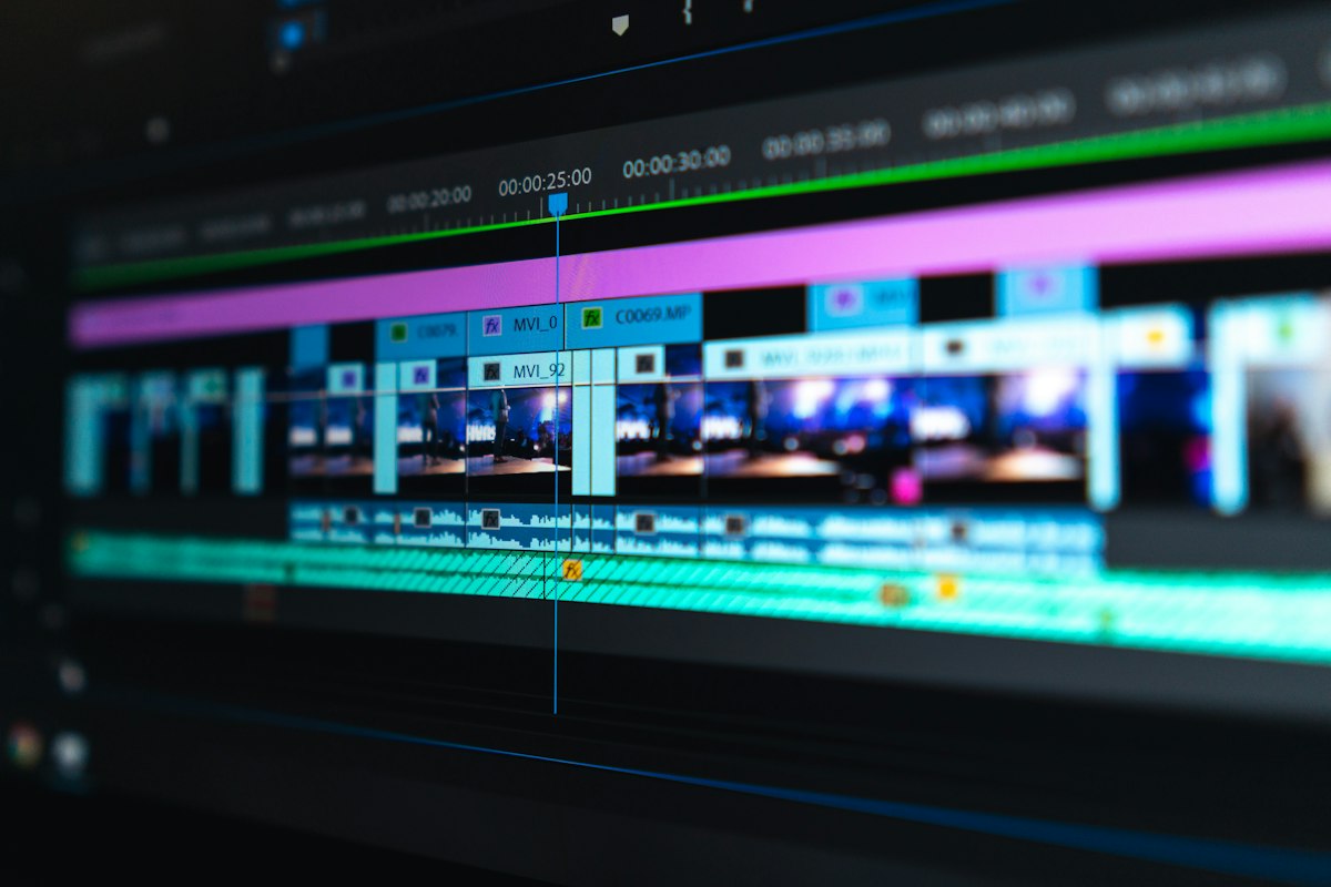 Video editing timeline displayed on a dual monitor workstation
