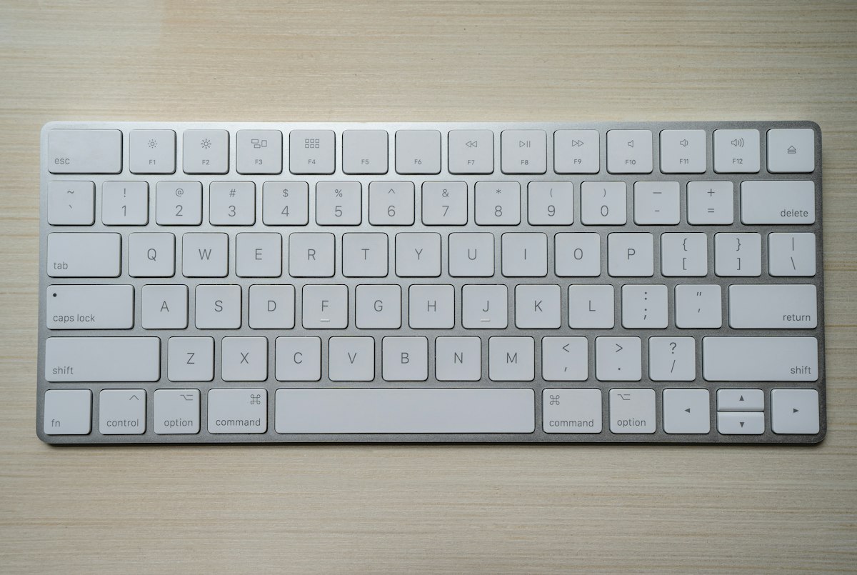 Software developer typing on illuminated mechanical keyboard while debugging JavaScript character encodings