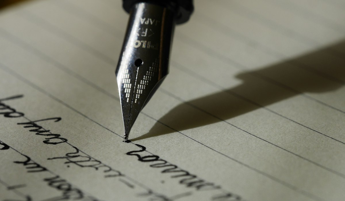 Annotated executive summary document with fountain pen