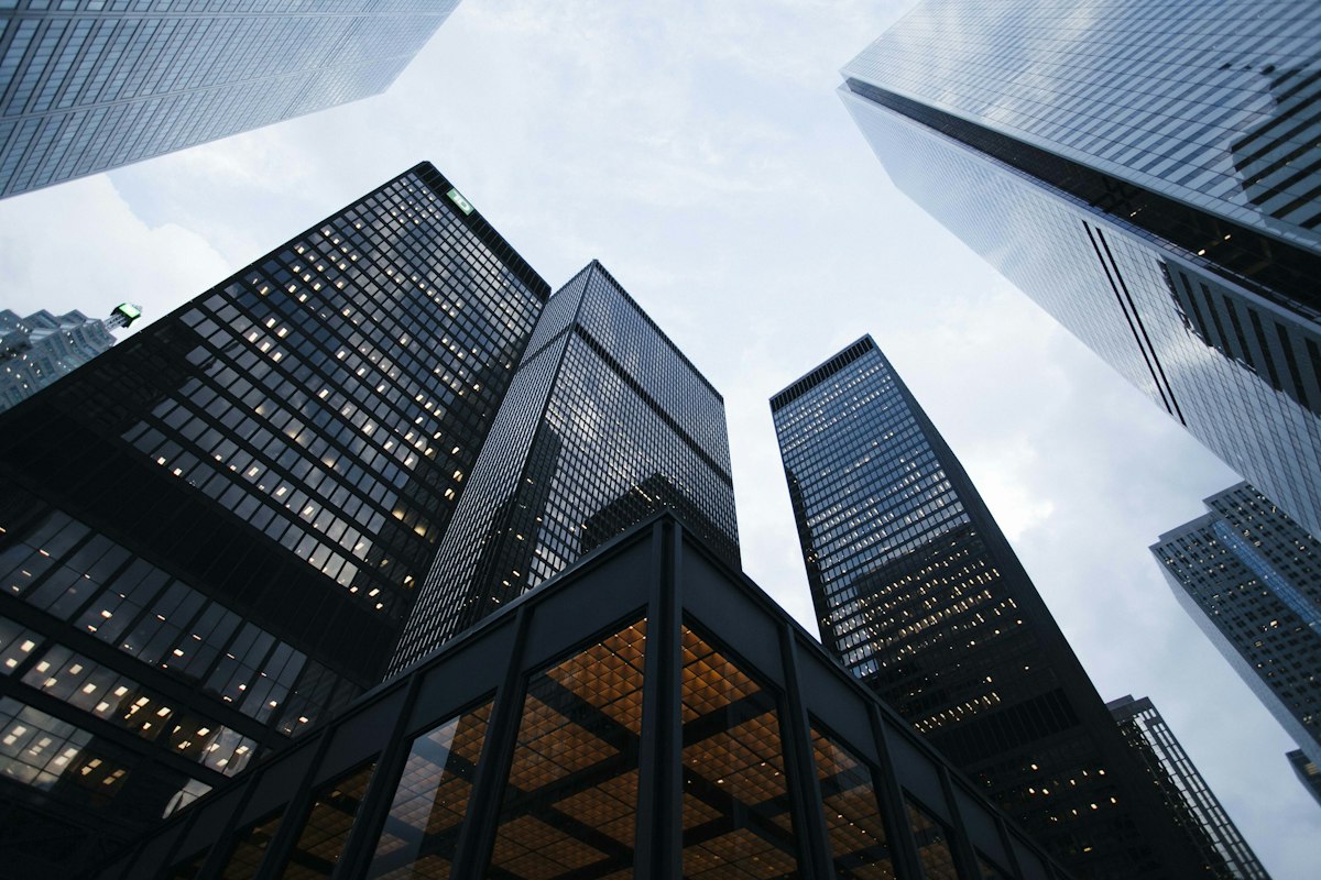 Corporate glass skyscraper reflecting business enterprise environment and boardroom leadership